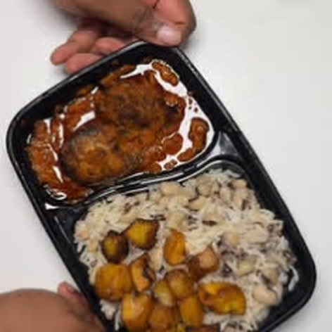 Rice and beans with fish stew and plantain